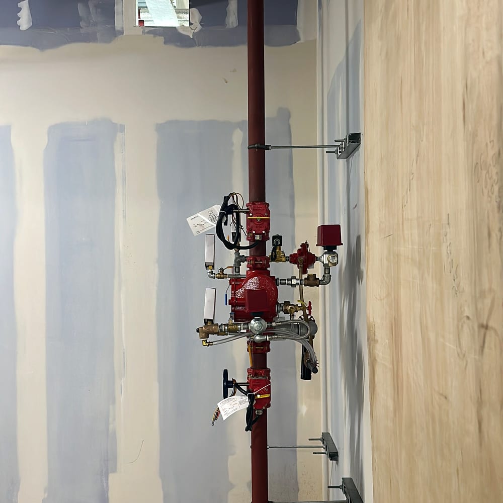An alarm valve set in a corridor, the centre of commercial sprinkler maintenance in London buildings