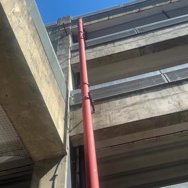 External riser running up a building facade