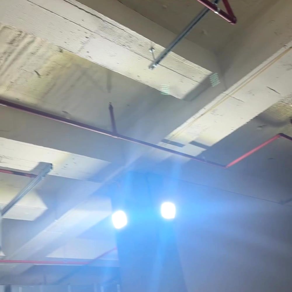 Sprinkler mains under a concrete soffit during fit-out